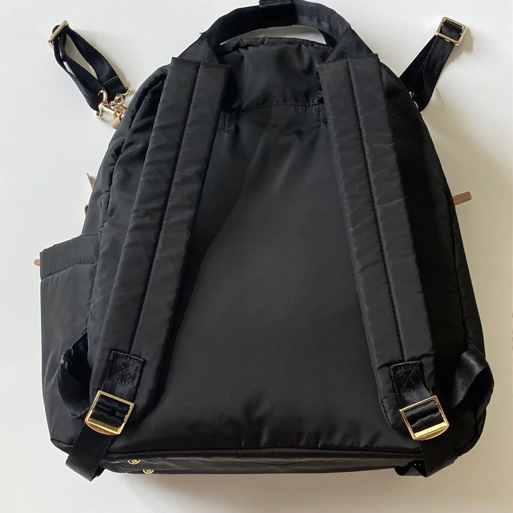 Skip Hop Black Quilted Multifunctional Backpack with Tan and gold accents